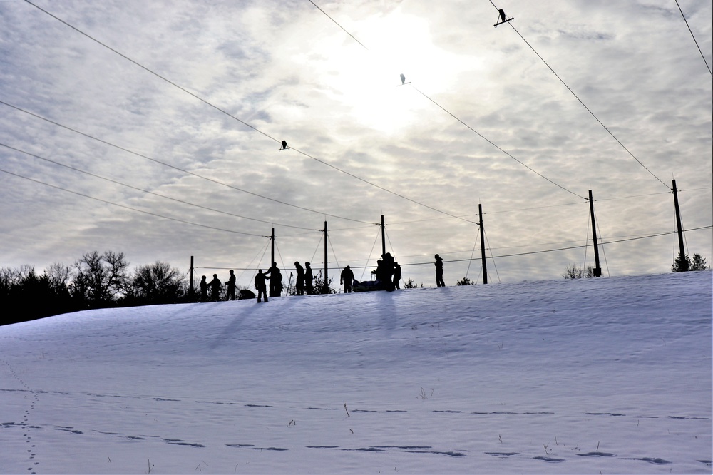 Fort McCoy CWOC class 21-03 students train using snowshoes, ahkio sleds
