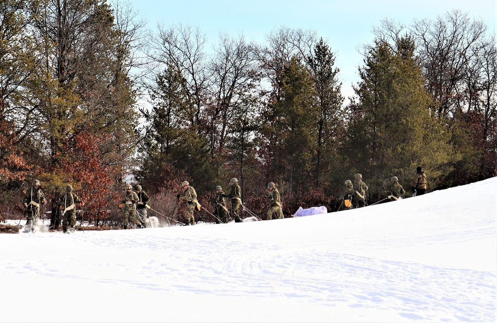 Fort McCoy CWOC class 21-03 students train using snowshoes, ahkio sleds