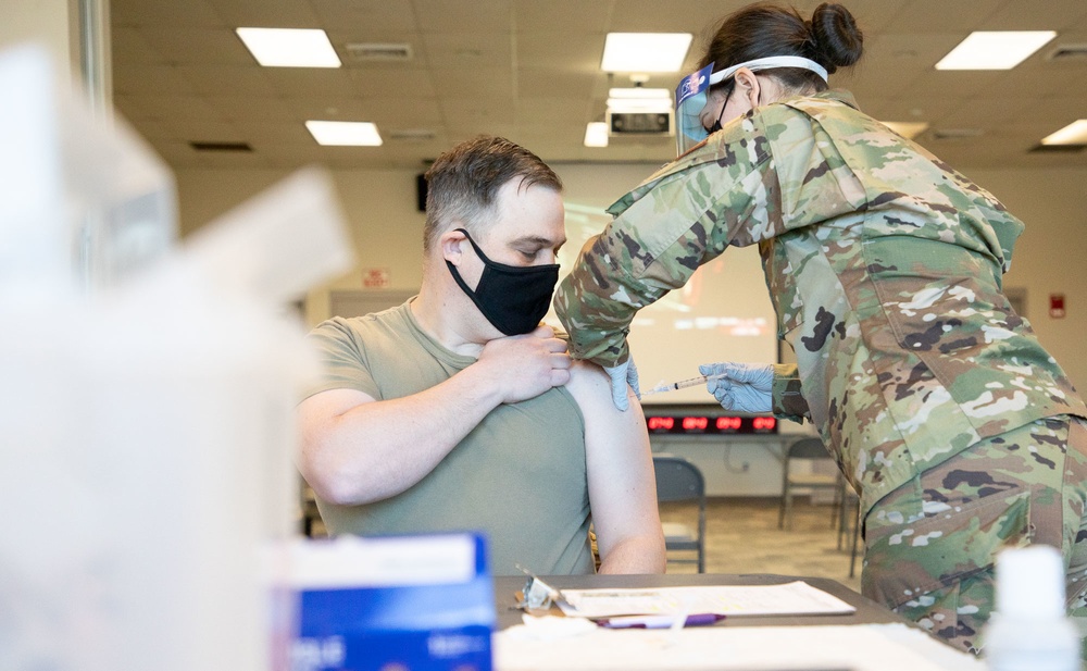 Massachusetts military forces join together to administer vaccine