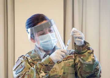 Massachusetts military forces join together to administer vaccine