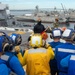 Sailors participate in a flight deck fire drill aboard Essex