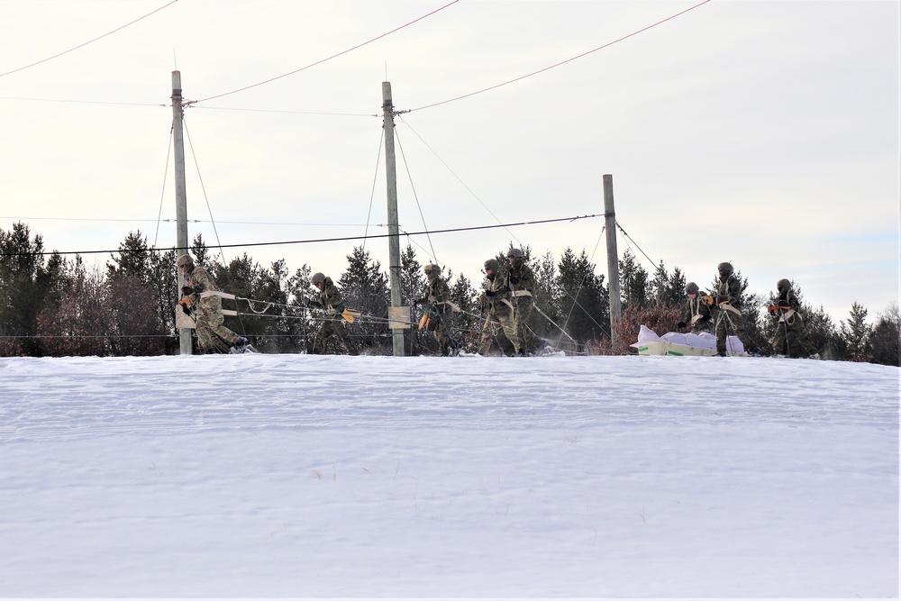 Fort McCoy CWOC class 21-03 students train using snowshoes, ahkio sleds