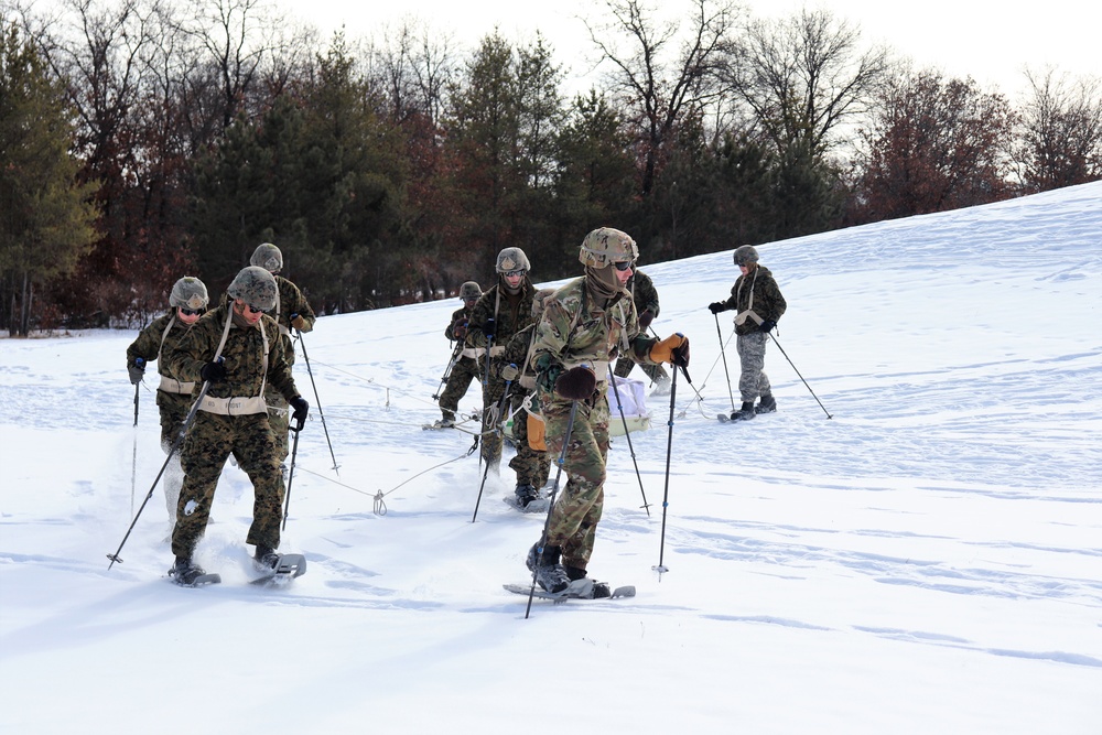 Fort McCoy CWOC class 21-03 students train using snowshoes, ahkio sleds