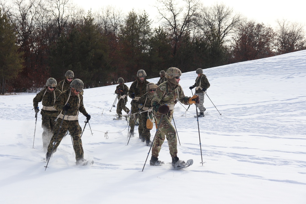 Fort McCoy CWOC class 21-03 students train using snowshoes, ahkio sleds