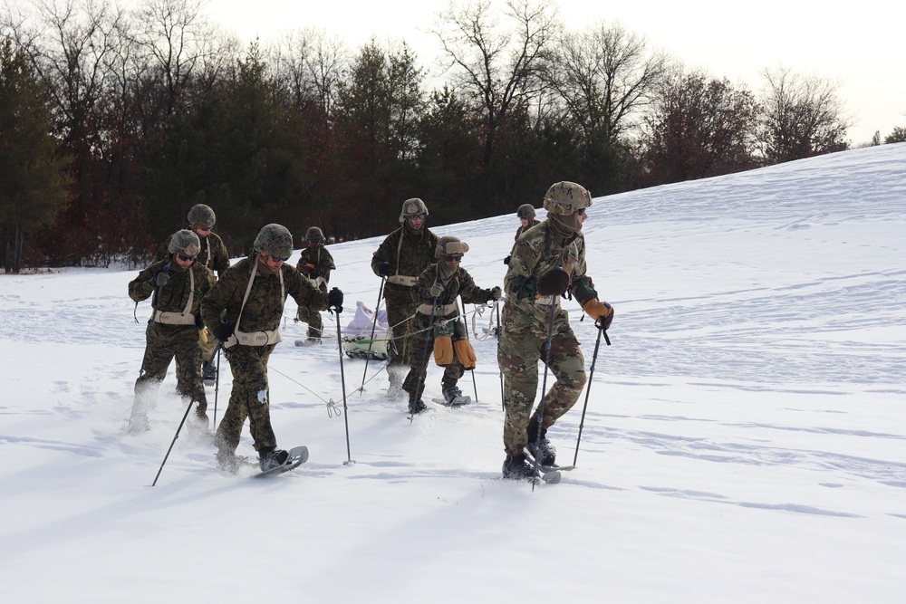 Fort McCoy CWOC class 21-03 students train using snowshoes, ahkio sleds