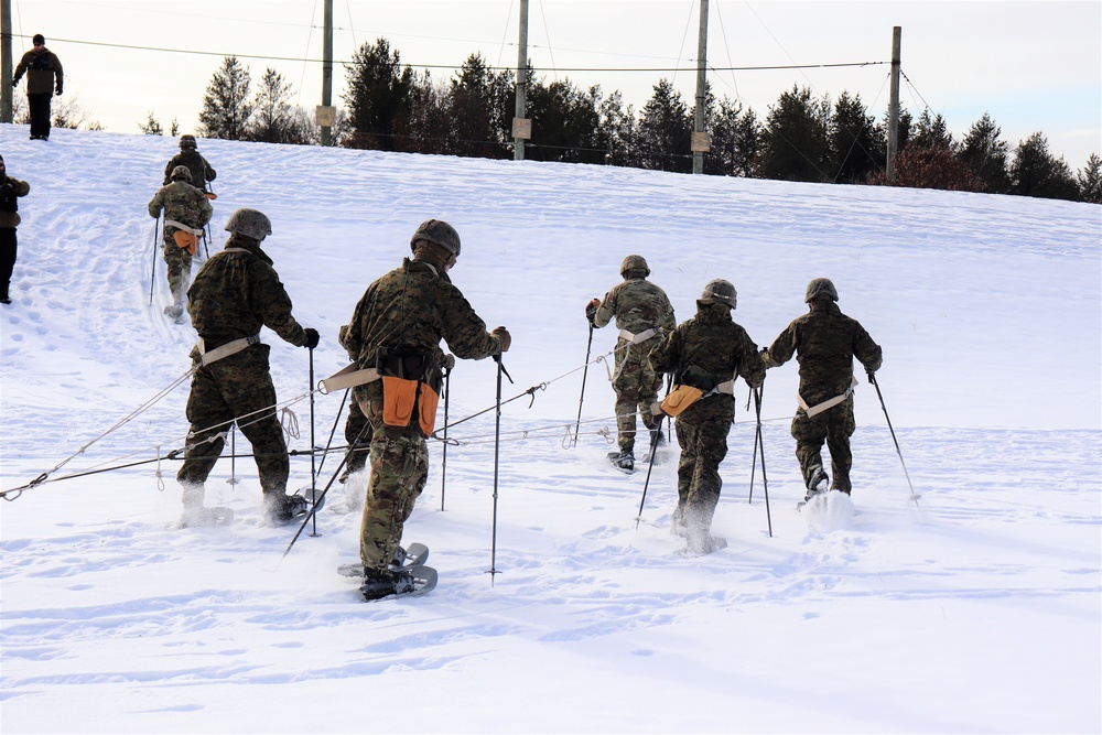 Fort McCoy CWOC class 21-03 students train using snowshoes, ahkio sleds