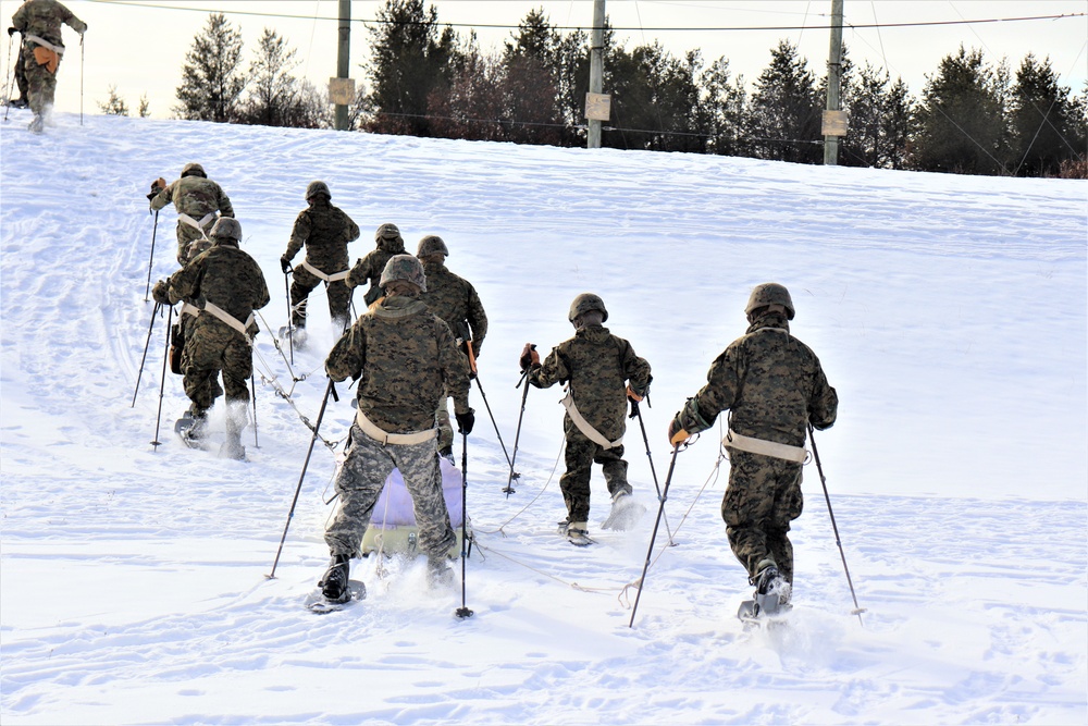 Fort McCoy CWOC class 21-03 students train using snowshoes, ahkio sleds