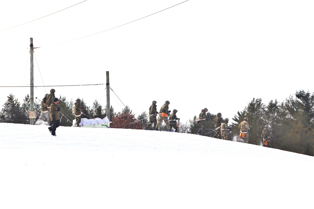 Fort McCoy CWOC class 21-03 students train using snowshoes, ahkio sleds