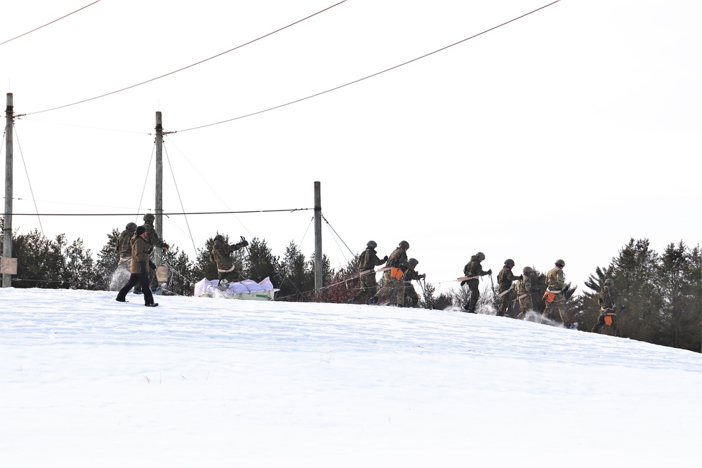 Fort McCoy CWOC class 21-03 students train using snowshoes, ahkio sleds