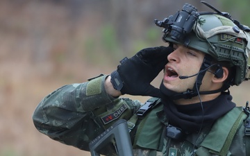 Brazilian Paratrooper calls out directions to fellow Paratroopers at JRTC RTN 21-04.