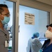 U.S. Air Force medical officer receives updates on patient status