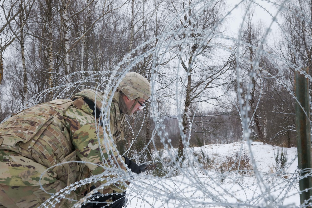 Cutting through concertina wire