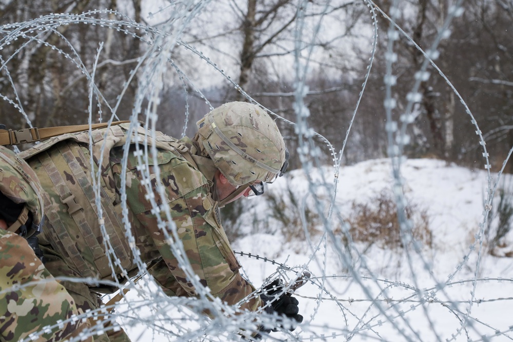 Cutting through concertina wire