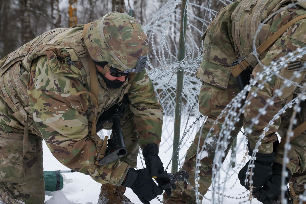 Cutting through concertina wire