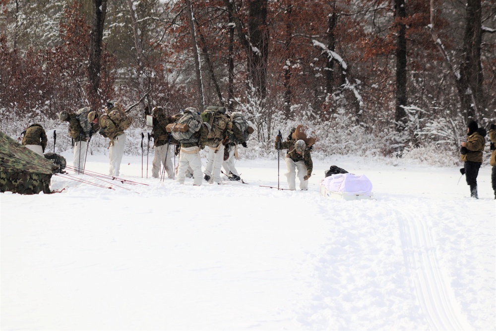 Fort McCoy CWOC class 21-03 students raise Artic tents during training scenario