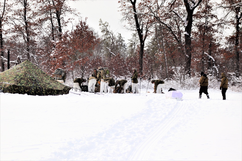 Fort McCoy CWOC class 21-03 students raise Artic tents during training scenario