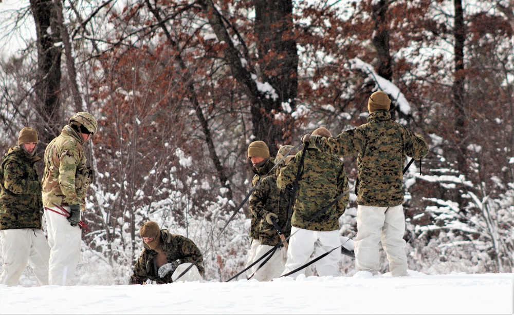 Fort McCoy CWOC class 21-03 students raise Artic tents during training scenario