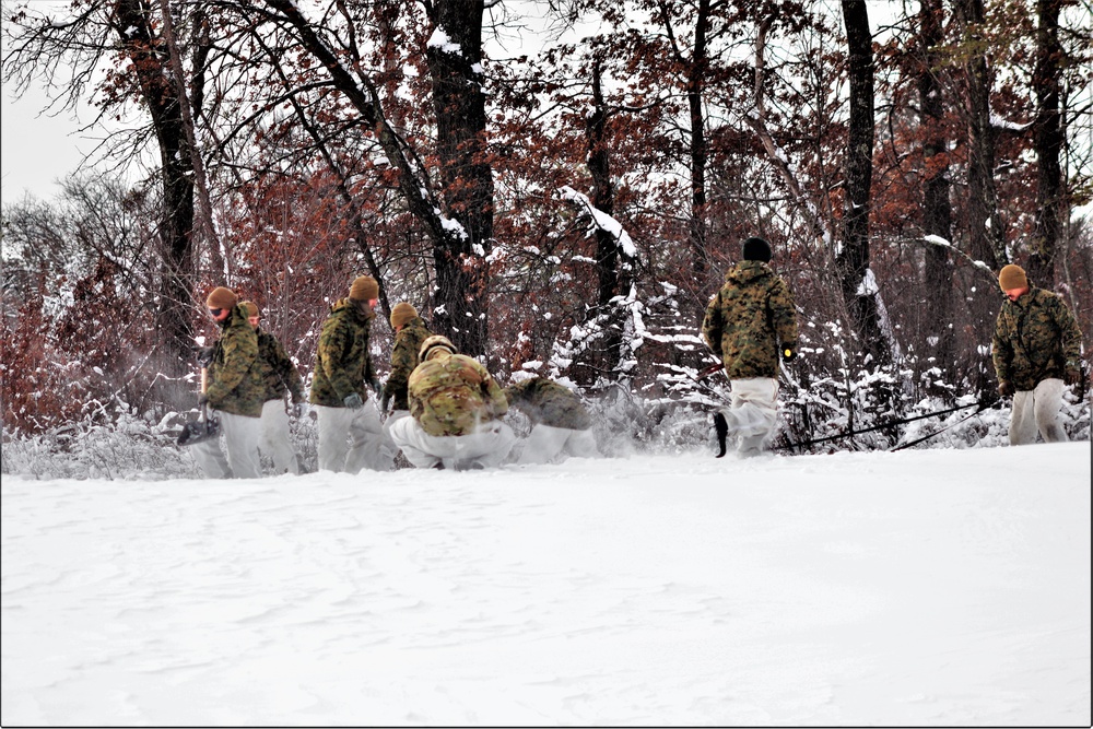 Fort McCoy CWOC class 21-03 students raise Artic tents during training scenario