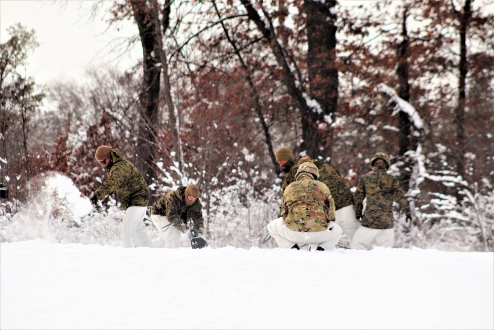 Fort McCoy CWOC class 21-03 students raise Artic tents during training scenario