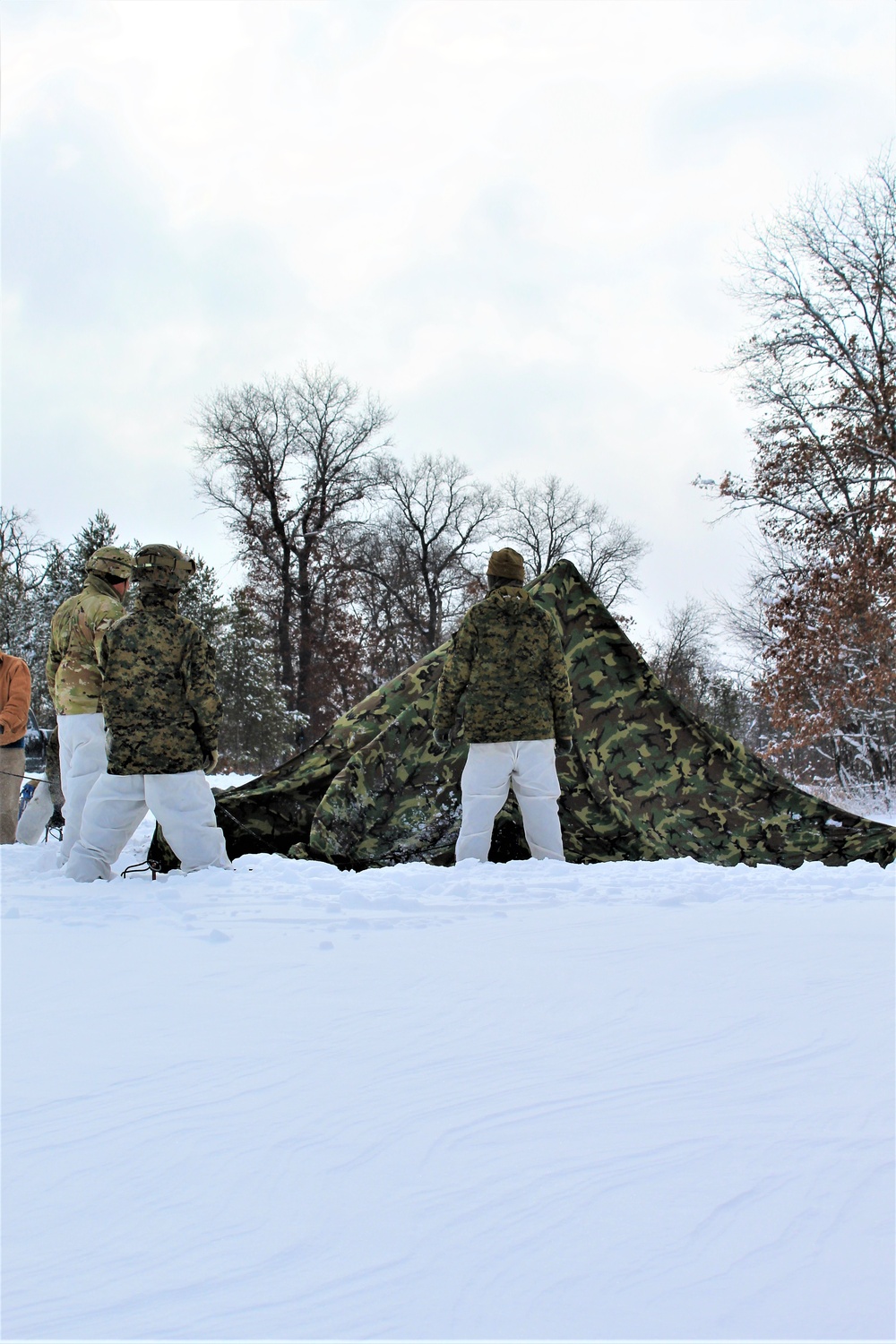 Fort McCoy CWOC class 21-03 students raise Artic tents during training scenario