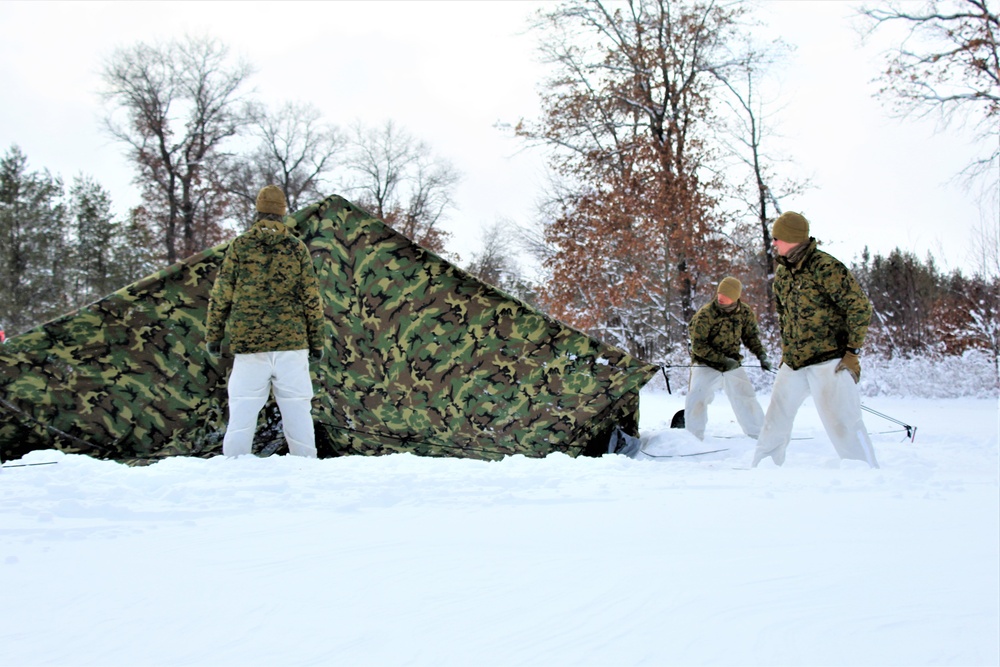 Fort McCoy CWOC class 21-03 students raise Artic tents during training scenario