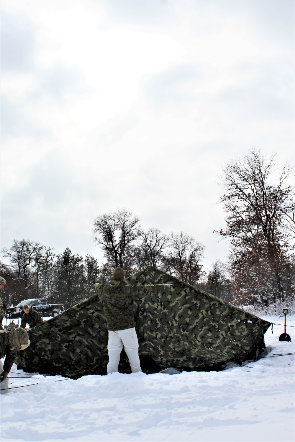 Fort McCoy CWOC class 21-03 students raise Artic tents during training scenario