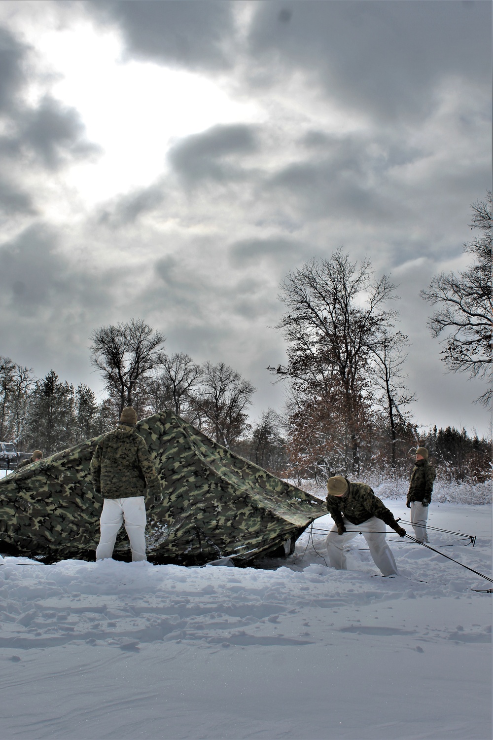 Fort McCoy CWOC class 21-03 students raise Artic tents during training scenario