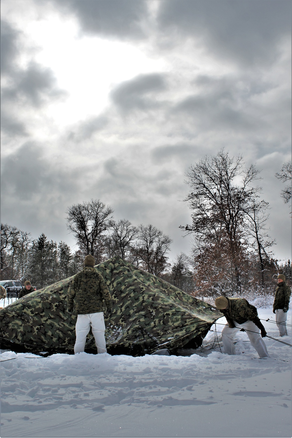 Fort McCoy CWOC class 21-03 students raise Artic tents during training scenario