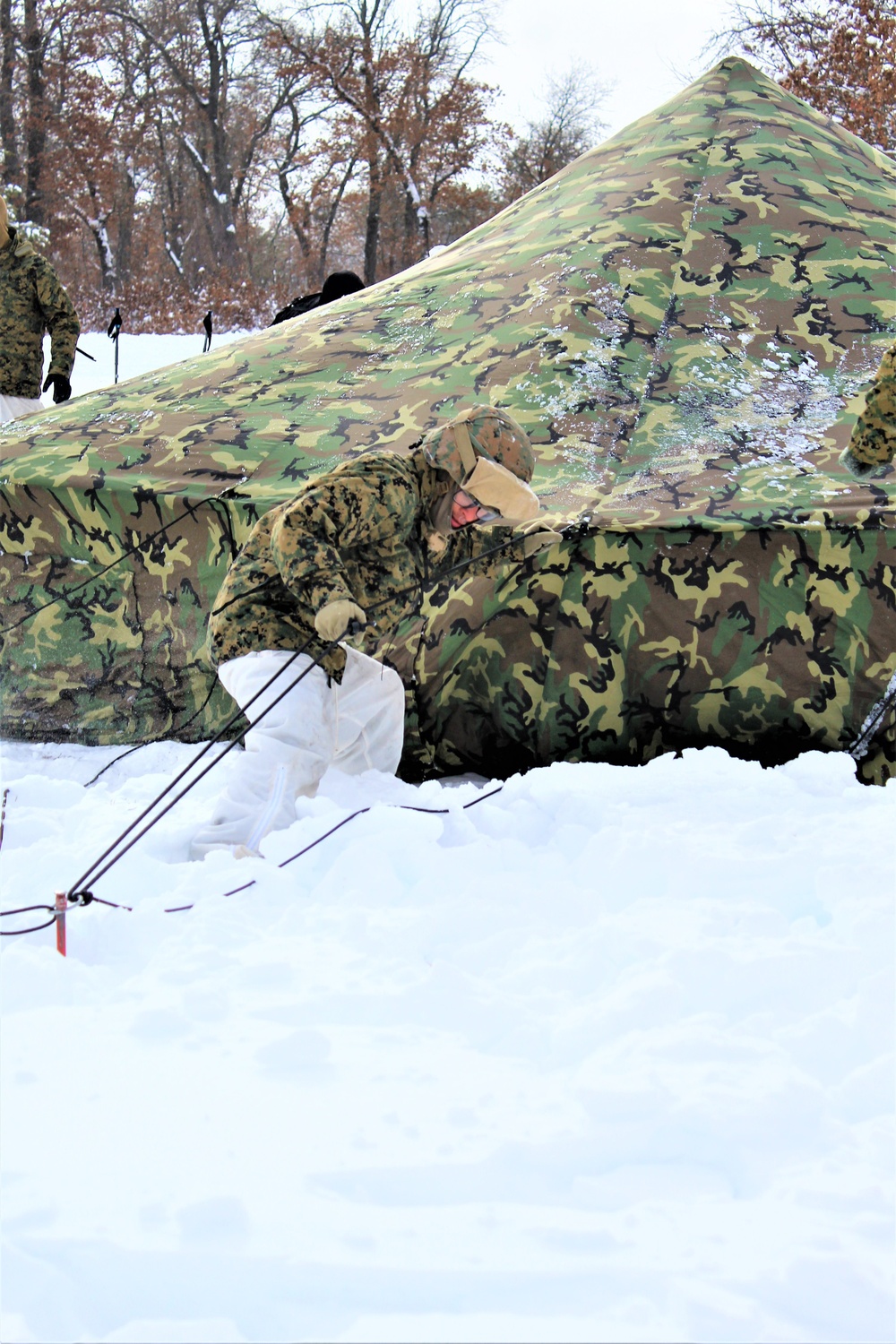 Fort McCoy CWOC class 21-03 students raise Artic tents during training scenario