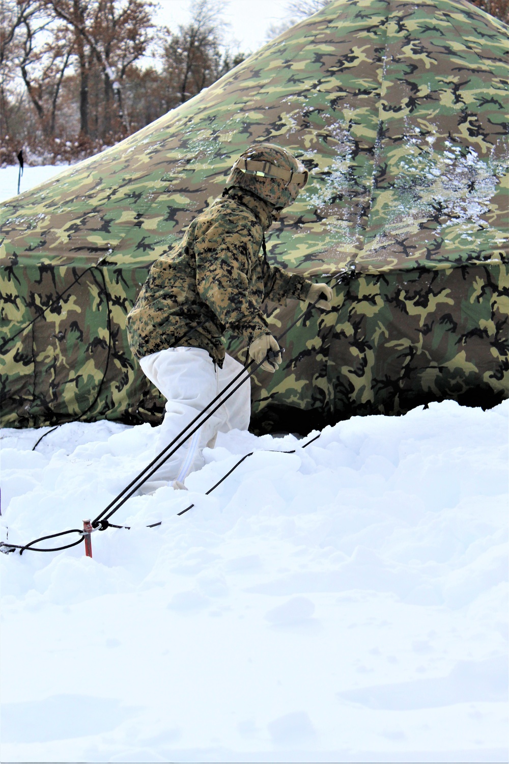 Fort McCoy CWOC class 21-03 students raise Artic tents during training scenario