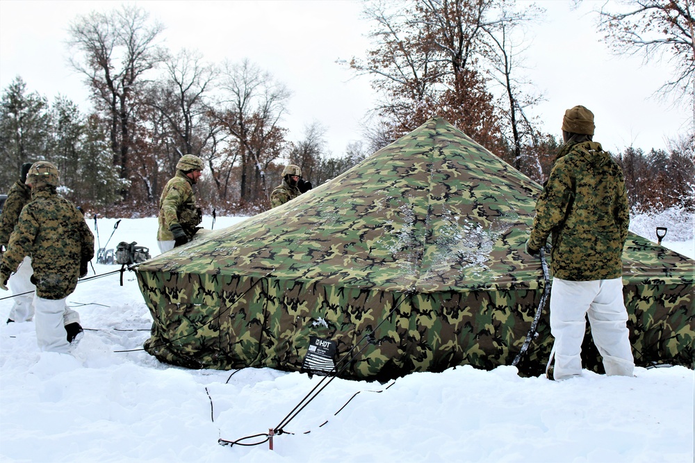 Fort McCoy CWOC class 21-03 students raise Artic tents during training scenario