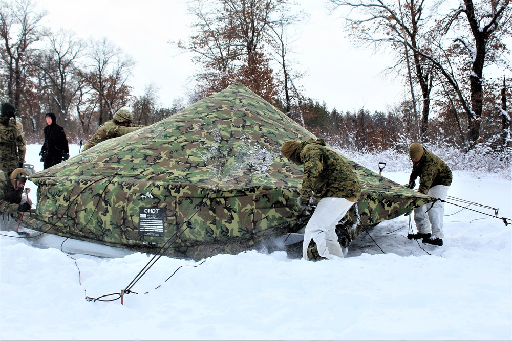 Fort McCoy CWOC class 21-03 students raise Artic tents during training scenario