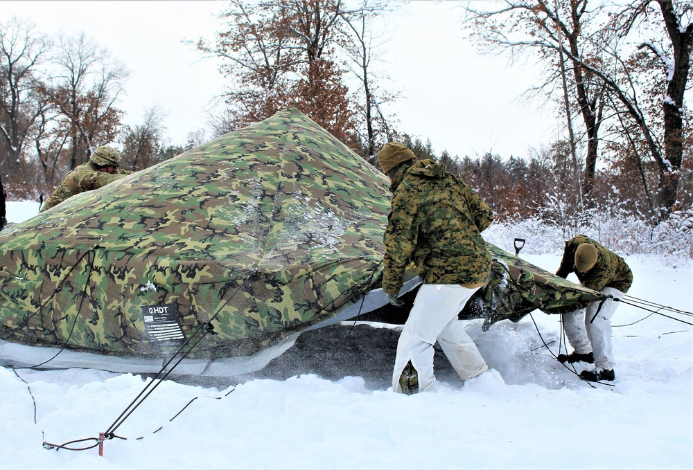 Fort McCoy CWOC class 21-03 students raise Artic tents during training scenario