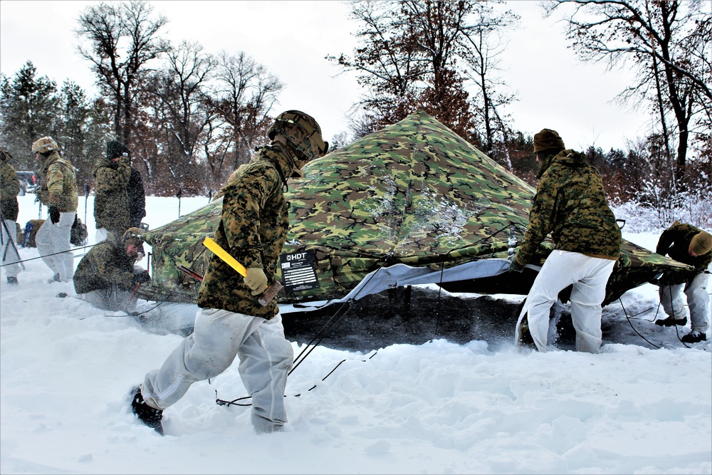 Fort McCoy CWOC class 21-03 students raise Artic tents during training scenario