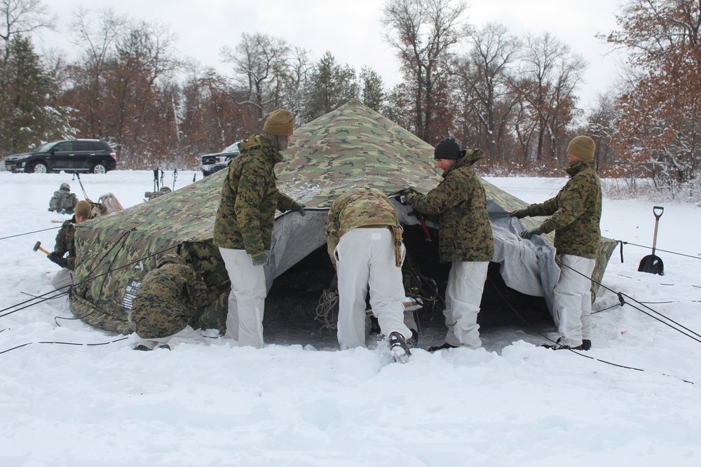 Fort McCoy CWOC class 21-03 students raise Artic tents during training scenario