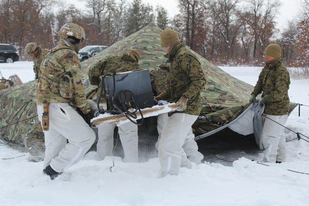 Fort McCoy CWOC class 21-03 students raise Artic tents during training scenario