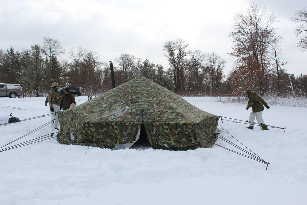 Fort McCoy CWOC class 21-03 students raise Artic tents during training scenario