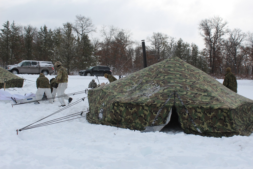 Fort McCoy CWOC class 21-03 students raise Artic tents during training scenario