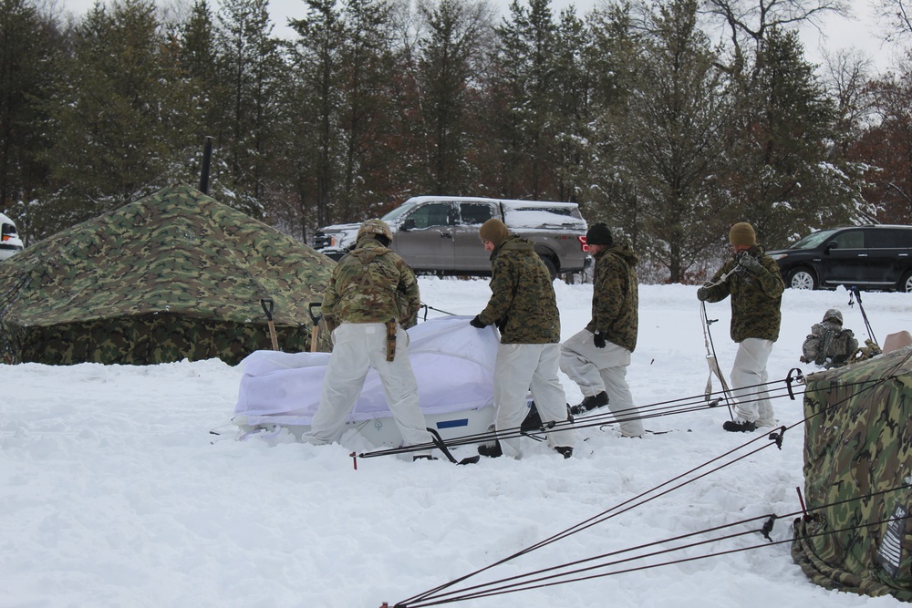 Fort McCoy CWOC class 21-03 students raise Artic tents during training scenario
