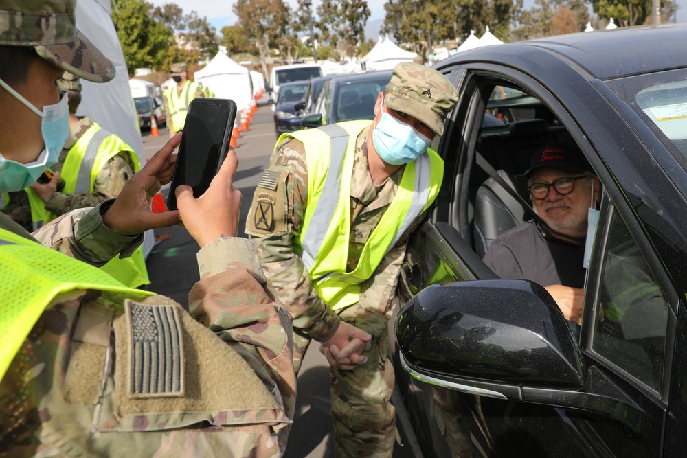 Film and TV actor Danny DeVito receives vaccine and poses for photos with Cal Guardsmen supporting vaccine efforts at Cal State LA