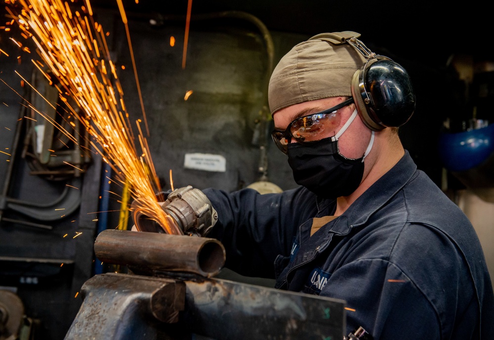 USS Carl Vinson (CVN 70) Sailors Braze, Grind and Weld in Machine Shop