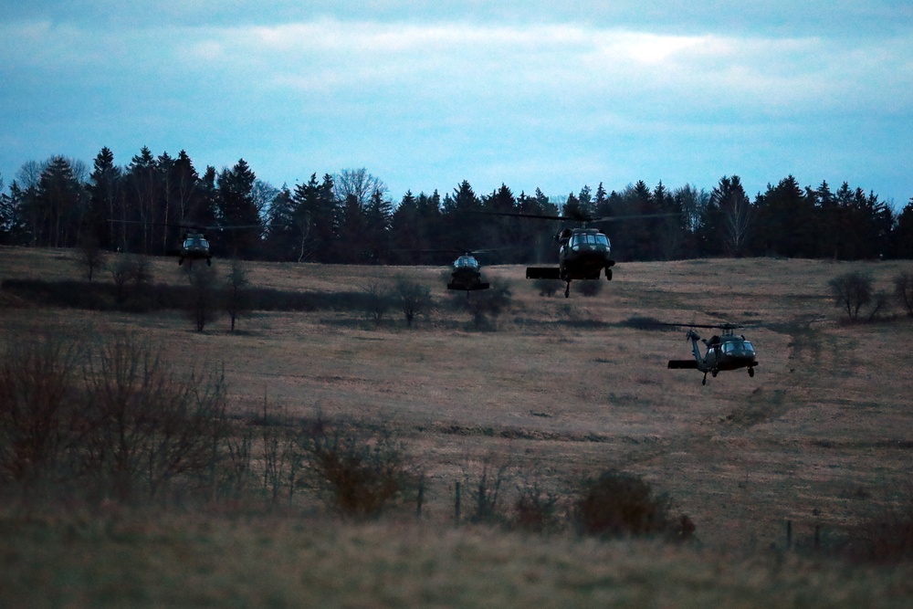 UH-60 Blackhawks prepare to land