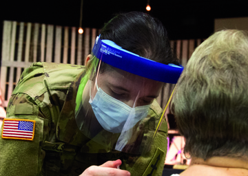 Michigan National Guard Soldier vaccinates family in childhood church