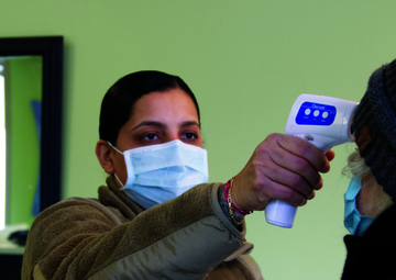 Michigan National Guard Soldier vaccinates family in childhood church