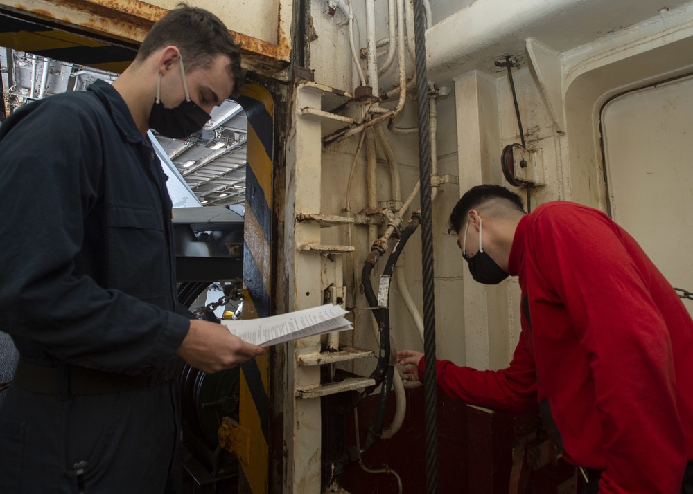 Sailors Inspect Weapons Elevator