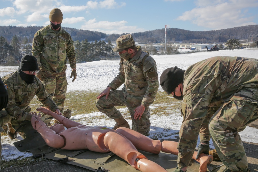 Soldiers load a simulated casualty