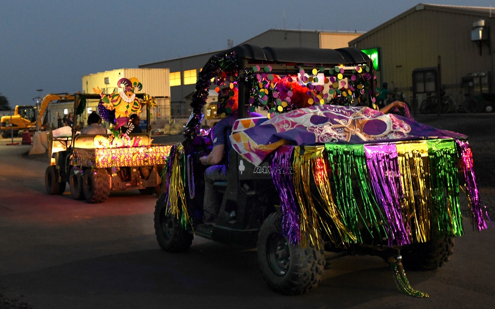 Service members participate in the annual MWR Mardi Gras themed “gator parade”