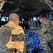 Soldiers load water for Texans into Blackhawk