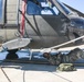 Soldier performs preventative maintenance on UH-60