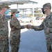 U.S. Army Col. Robert Wooldridge awards coins to Cal Guardsmen at Cal State LA vaccine site